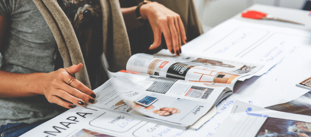 woman looking at magazine