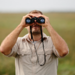 man with binoculars